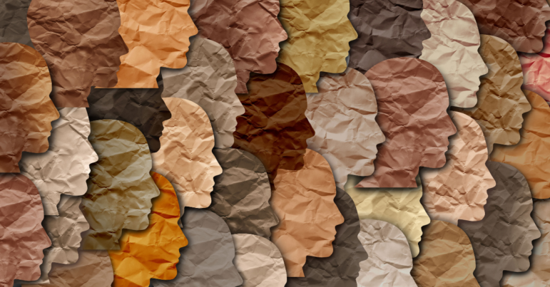 cutouts of faces in different shades and neutral colors